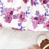 Vestido Jardineira Flores e Lacinho